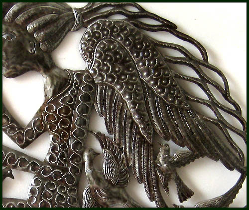 Close-up of angel design. Haitian steel drum art.