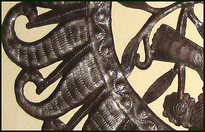 Close-up of bird design. Haitian steel drum metal art.