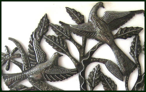 Close-up Haitian steel drum tree of life wall decor.